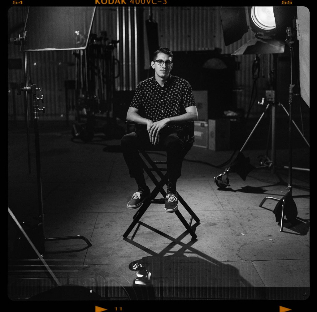 black and white photo of Tod Brewster in a chair